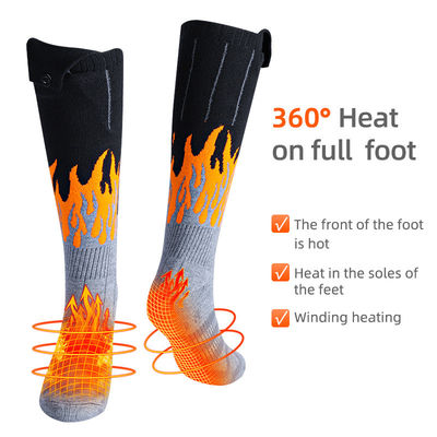 Il termale elettrico dell'inverno ha riscaldato i calzini lavabili con la batteria ricaricabile